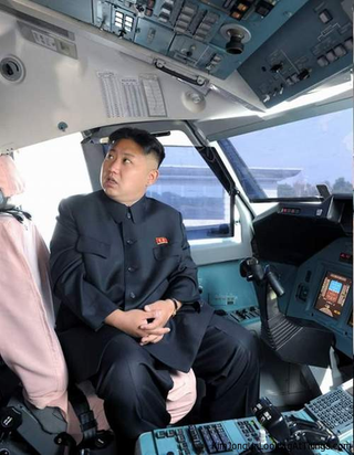Illustration for article titled Here's Kim Jong Un Pretending To Fly A Plane For Some Reason